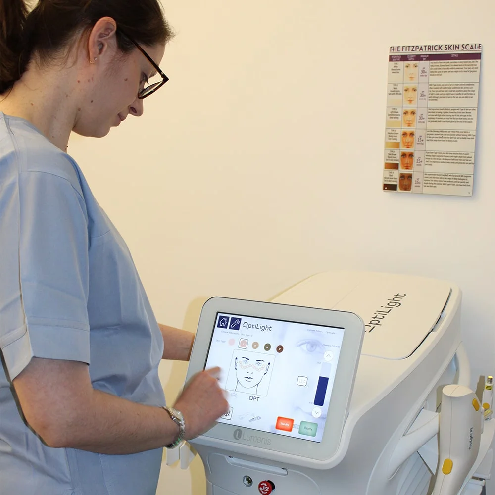 Clinician operating the OptiLight IPL machine